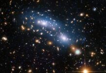 Scientists used intracluster light (visible in blue) to study the distribution of dark matter within the cluster.jpg